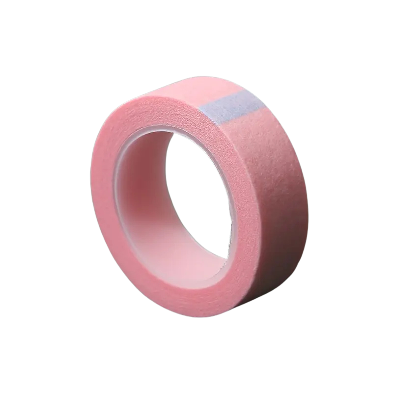 Pink microporous tape roll on a white background